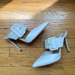 White pointed toe mule heels w buckle detail